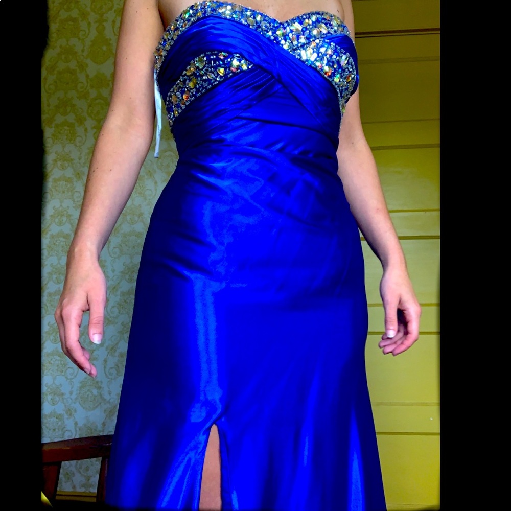Strapless Prom dress with rhinestones at the top.